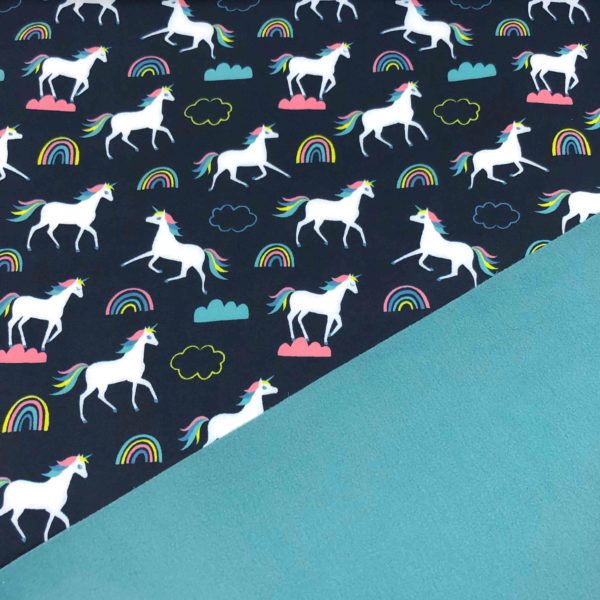 Tela softshell de unicornios fondo azul marino y reverso color petrol