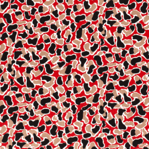 Tejido de viscosa con estampado de manchas sobre fondo rojo