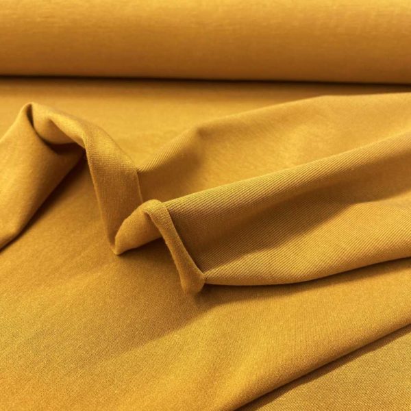 Tela de bambú con algodón tipo punto de camiseta lisa color ocre