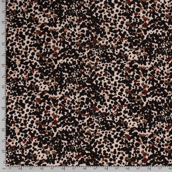 Tejido de viscosa con estampado de manchas de pincel fondo beige