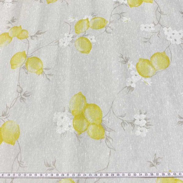 Hule resinado estampado con limones y flores