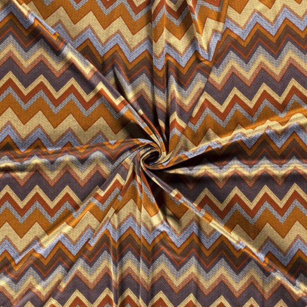 Tejido de viscosa y poliéster estampado en zig zag ocre