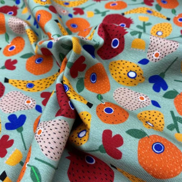 Punto de camiseta estampada tipo Jersey con frutas fondo mint