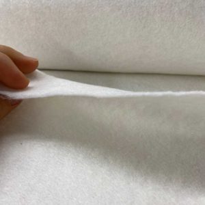 Guata, boata, napa o material de relleno para acolchar de algodón y poliéster, termoadhesivo por uno de los lados