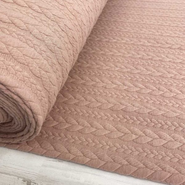 Jersey de punto con patrón trenzado tipo Jacquard. Suave y agradable. Color rosa