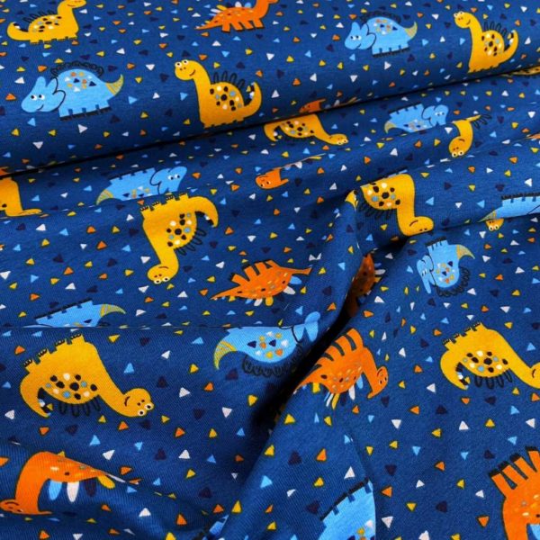 Tela de punto de camiseta de algodón orgánico tipo Jersey estampado con dinosaurios y triceratops fondo azul petrol