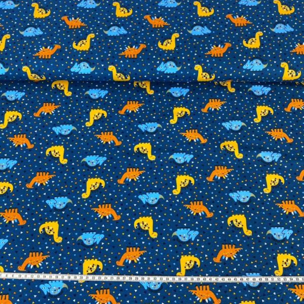 Tela de punto de camiseta de algodón orgánico tipo Jersey estampado con dinosaurios y triceratops fondo azul petrol