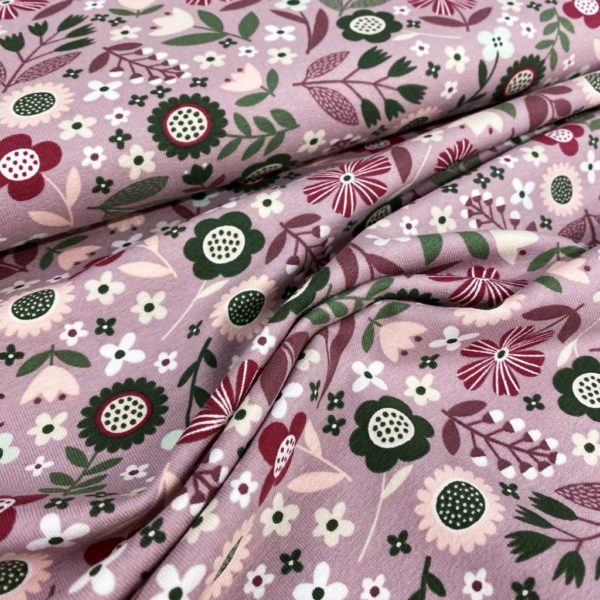 Tela de punto de camiseta de algodón orgánico tipo Jersey estampado primaveral con flores fondo lila