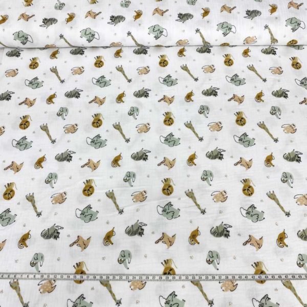 Tela de muselina o tela de doble gasa, algodón 100x100. Tejido con estampado de animales de la jungla fondo blanco.