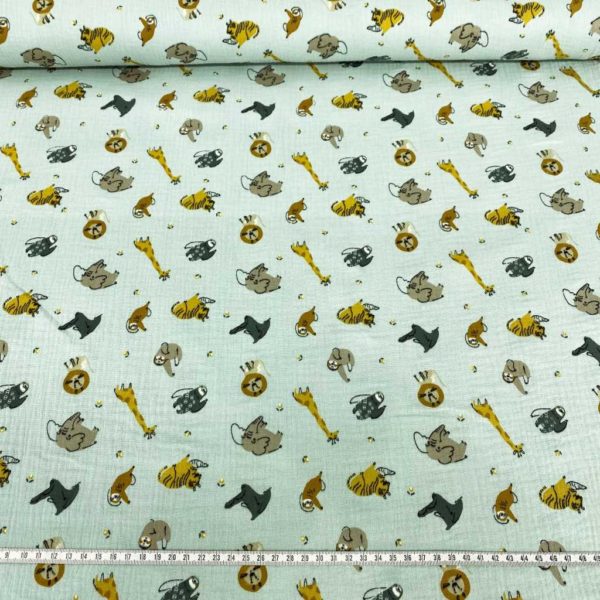 Tela de muselina o tela de doble gasa, algodón 100x100. Tejido con estampado de animales de la jungla fondo mint.