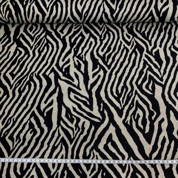 Tela de punto de viscosa elástica estampada animal print zebra en color gris y negro.