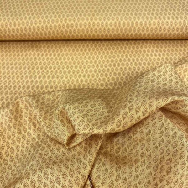 Tela de vestir de viscosa 100% estampado con formas inidas tonos ocres o mostaza u formas triangulares en marrón