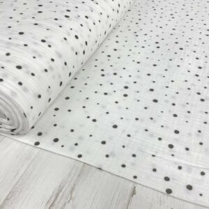 Tela de muselina o tela de doble gasa, algodón 100x100. Tejido con estampado de bolitas de nieve o topos en gris fondo blanco.