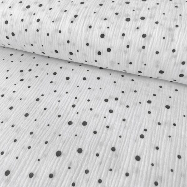 Tela de muselina o tela de doble gasa, algodón 100x100. Tejido con estampado de bolitas de nieve o topos en gris fondo blanco.