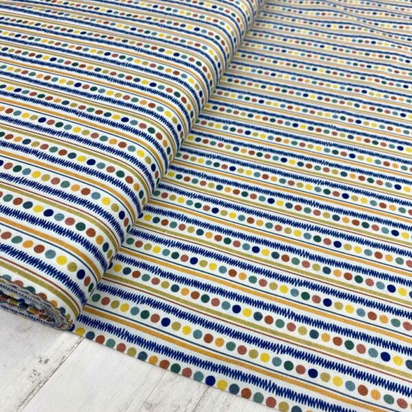 Tela de algodón estampada con bolitas de colores fondo blanco. Tela de algodón tipo popelín para todo tipo de creatividades de Patchwork, manualidades o confecciones creativas.