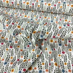 Tela de algodón estampada con margaritas con tallo alto y fondo blanco. Tela de algodón tipo popelín para todo tipo de creatividades de Patchwork, manualidades o confecciones creativas.