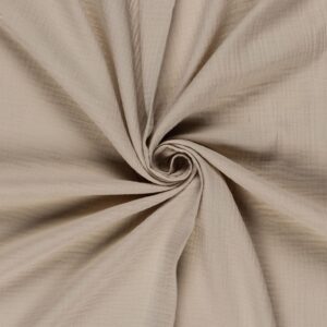 Tela de muselina o doble gasa de algodón beige. Tejido de algodón muy suave y ligero. Textura rugosa y transiprable. Ideal para confecciones del hogar o infantiles.