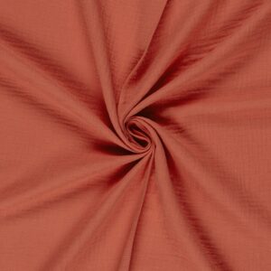 Tela de muselina o doble gasa de algodón coral. Tejido de algodón muy suave y ligero. Textura rugosa y transiprable. Ideal para confecciones del hogar o infantiles.
