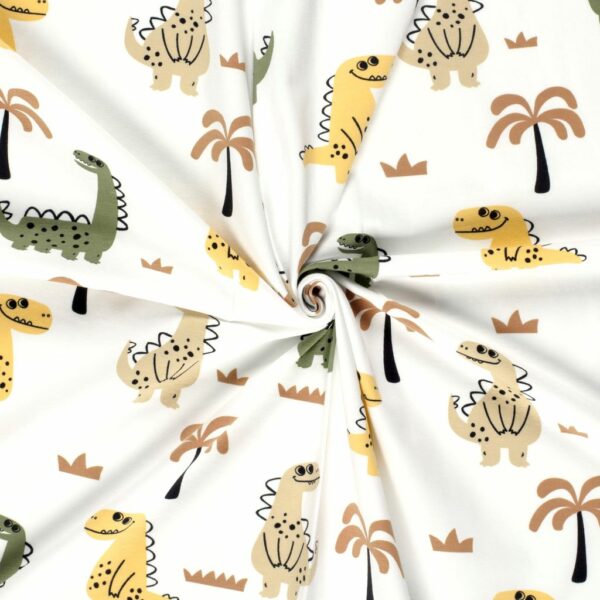 Tela de punto de camiseta de algodón orgánico. Tipo Jersey estampado con dinosaurios en color amarillo, verde y beige fondo blanco roto.