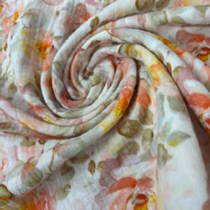 Muselina de algodón floral de seda, ideal para prendas elegantes y delicadas, con un diseño colorido y suave.