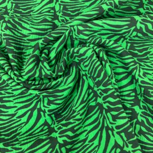 Muselina de animal print zebra en tonos rosas y rojos, ideal para confección y decoración.