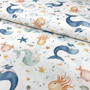 Algodón con estampado de animales marinos y estrellas.